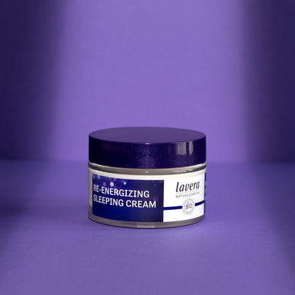 Lavera Re-Energising Sleeping Cream jar with white text and glowing network graphics, shown on a purple background.