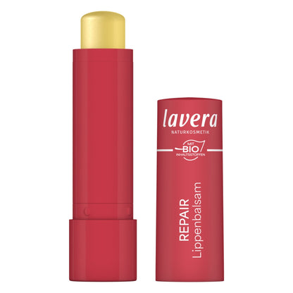 Lavera Lip balm repair shown with the red cap removed and standing beside the cap, on a plain white background.
