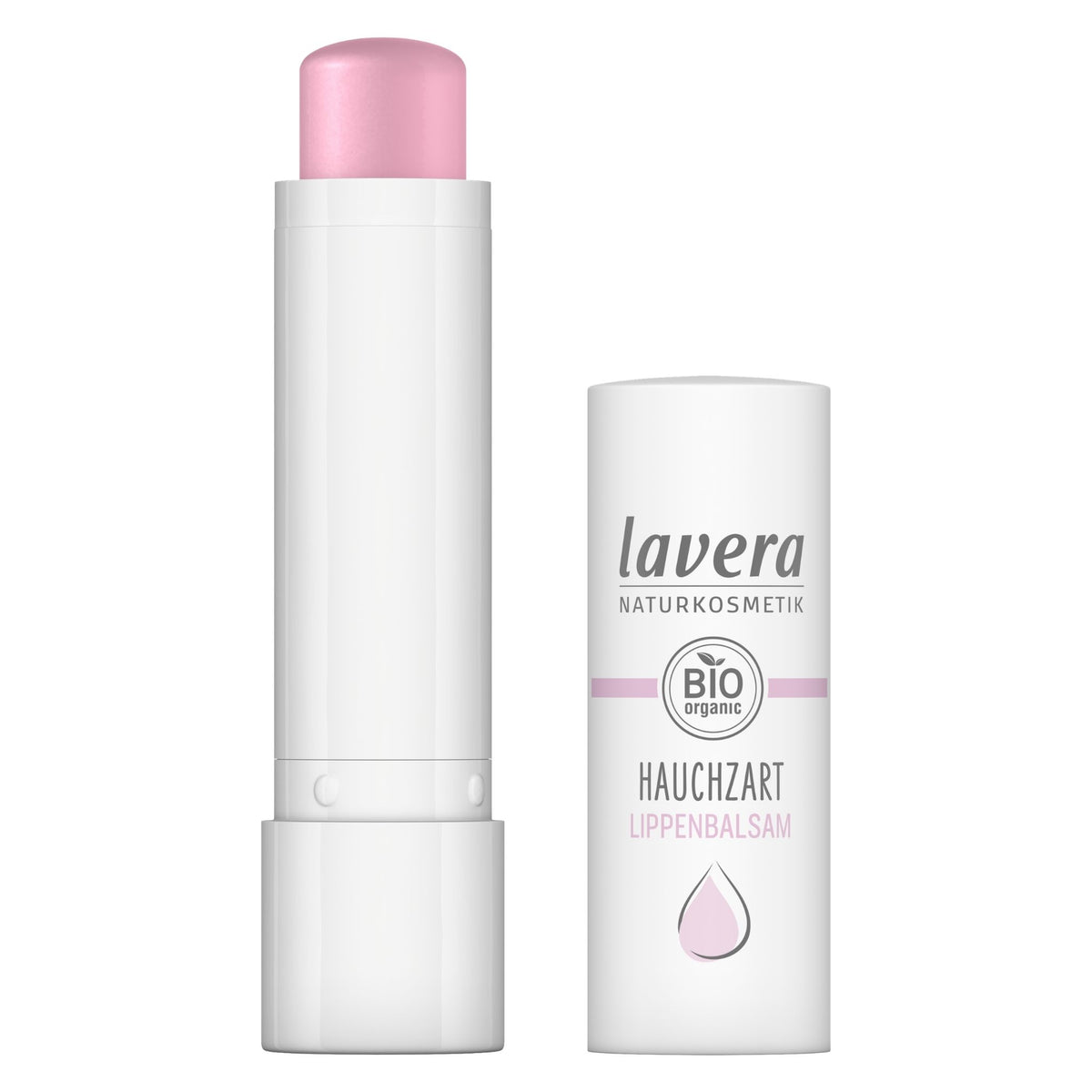 Lavera Natural lip balm shown with the cap removed, revealing a pale pink balm stick, alongside its white cylindrical packaging container on a plain white background.