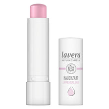 Lavera Natural lip balm shown with the cap removed, revealing a pale pink balm stick, alongside its white cylindrical packaging container on a plain white background.