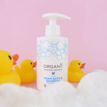 Organii fresh foam bath and shampoo for sensitive skin on pink background with yellow rubber duck