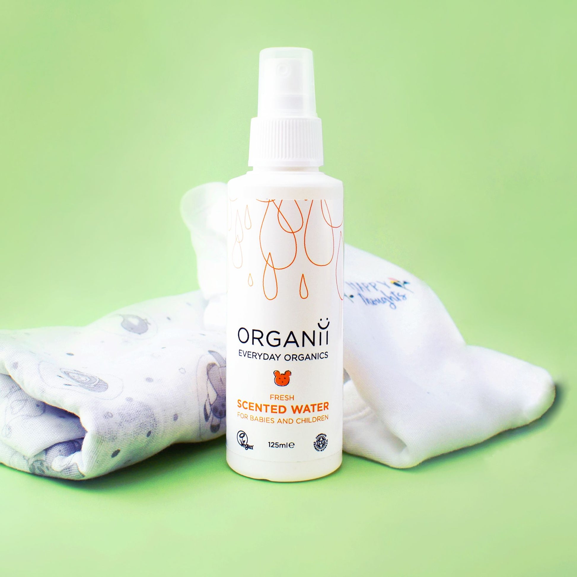 Organii Fresh Scented Water for Babies and Children  bottle on green background