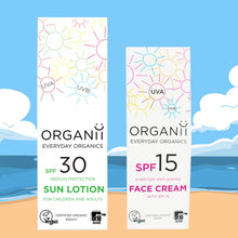 Organii Everyday Sun Care Duo features a box containing SPF30 Sun Milk and a Box containing SPF15 Face Cream on a beach background