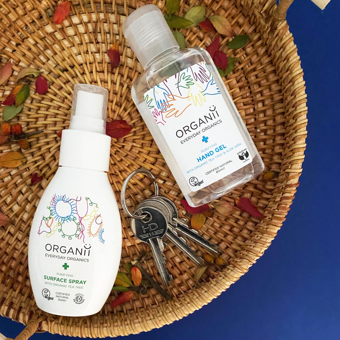 Organii Purifying Surface Spray in a bottle and hand gel in brown basket