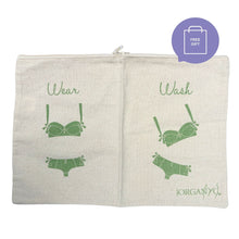 An off-white canvas zippered pouch with green printed graphics showing a bra and underwear under the words 'Wear' and 'Wash', on a white background with a purple 'FREE GIFT' badge in the top right.