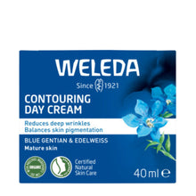 Weleda Contouring Day Cream 40ml packaging box, featuring a dark blue background with white text, blue flowers, and certification logos.