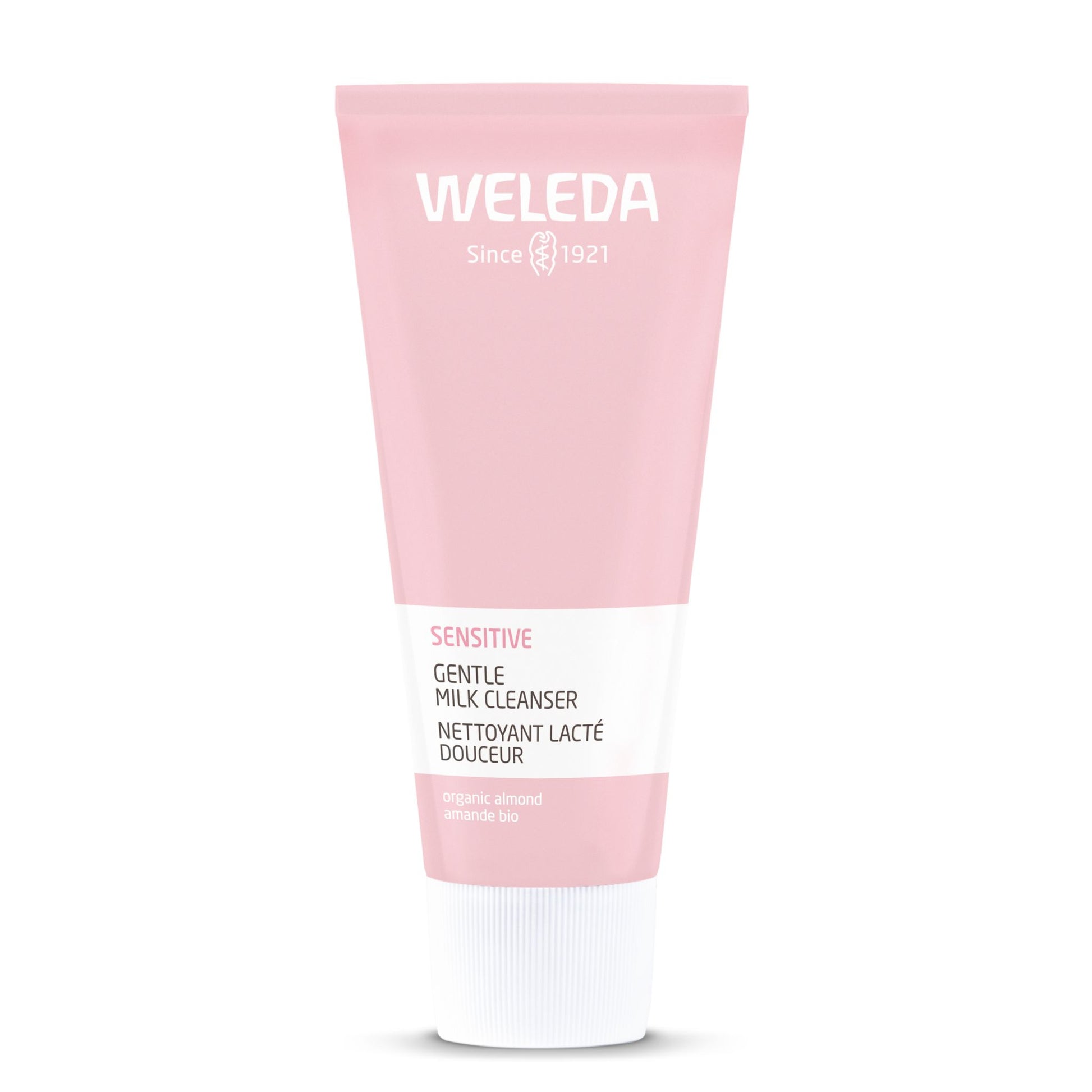 A pink squeeze tube of Weleda Sensitive Gentle Milk Cleanser with a white cap, centered on a plain white background.