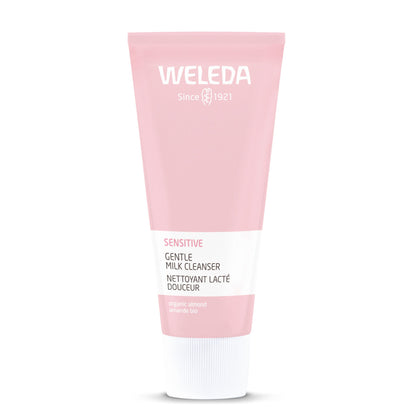 A pink squeeze tube of Weleda Sensitive Gentle Milk Cleanser with a white cap, centered on a plain white background.