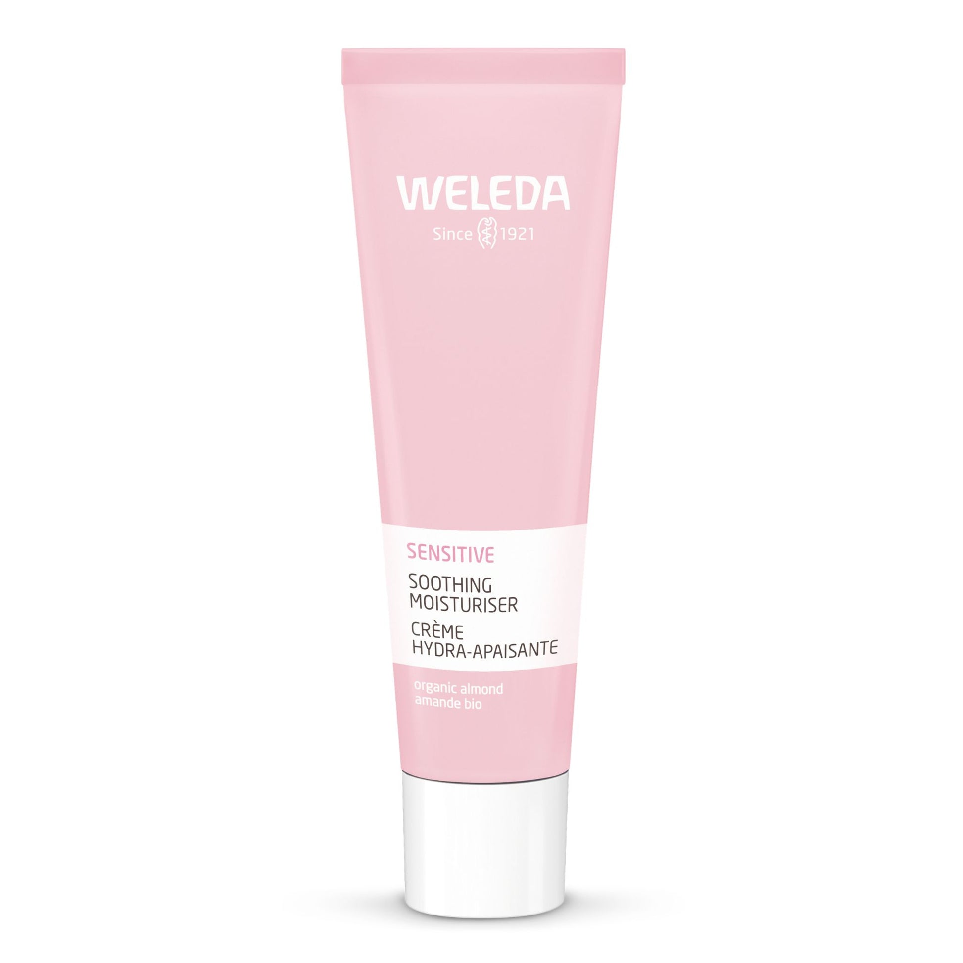 A pink squeeze tube of Weleda Sensitive Soothing Moisturiser with a white cap, centered on a clean white background.